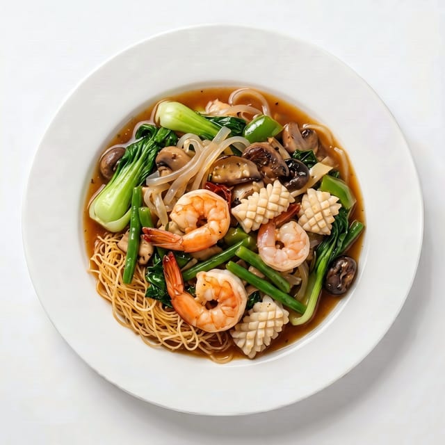 Stir-Fried Shrimp, Calamari, Crab Stick, & Vegetables on Top of Egg Noodles or Rice Noodles.