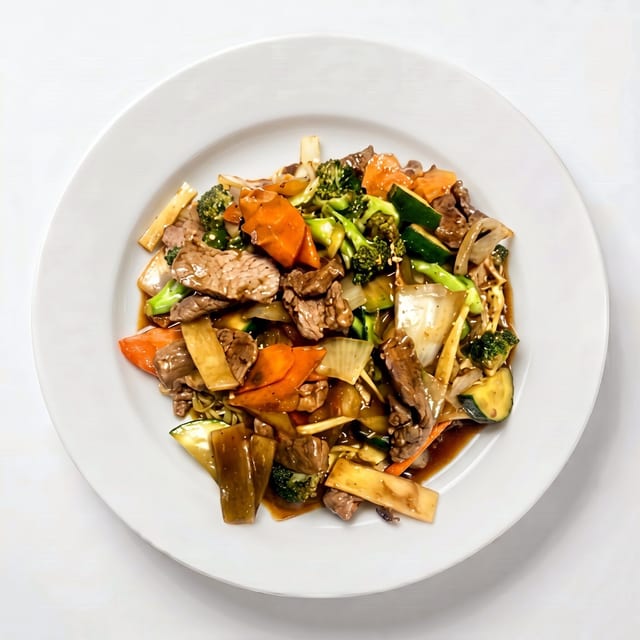 Stir-Fried Beef & Vegetables on Top of Egg Noodles or Rice Noodles.
